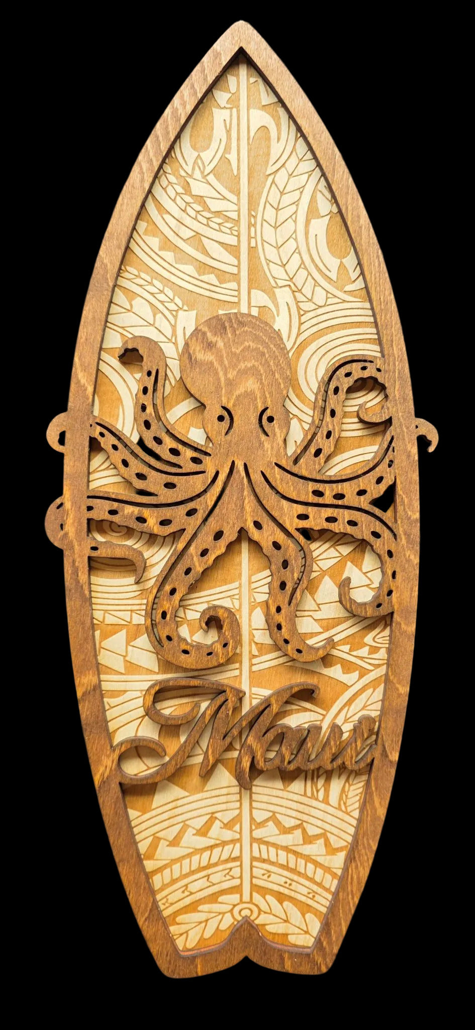 Wooden surfboard-shaped decorative item with an octopus design and 'Alaska' text on a black background