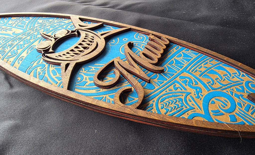 Wooden decorative item with intricate carvings on a blue background