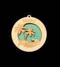 Wooden ornament with 'Maui' text and tropical design on a black background
