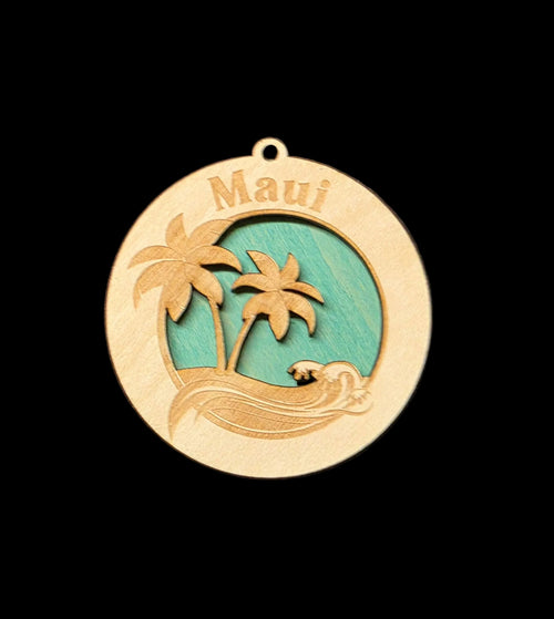 Wooden ornament with 'Maui' text and tropical design on a black background