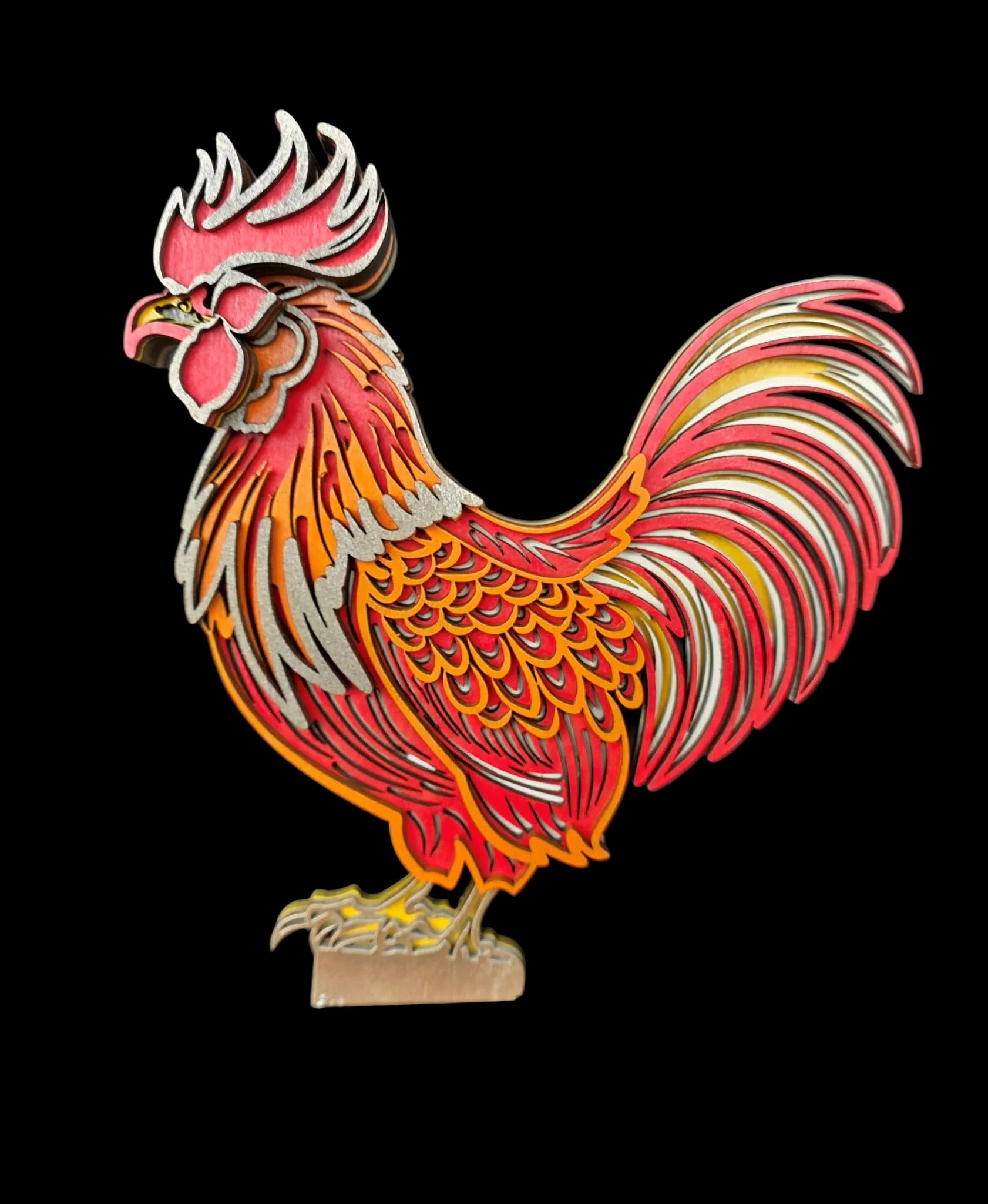 Colorful rooster sculpture on a black background