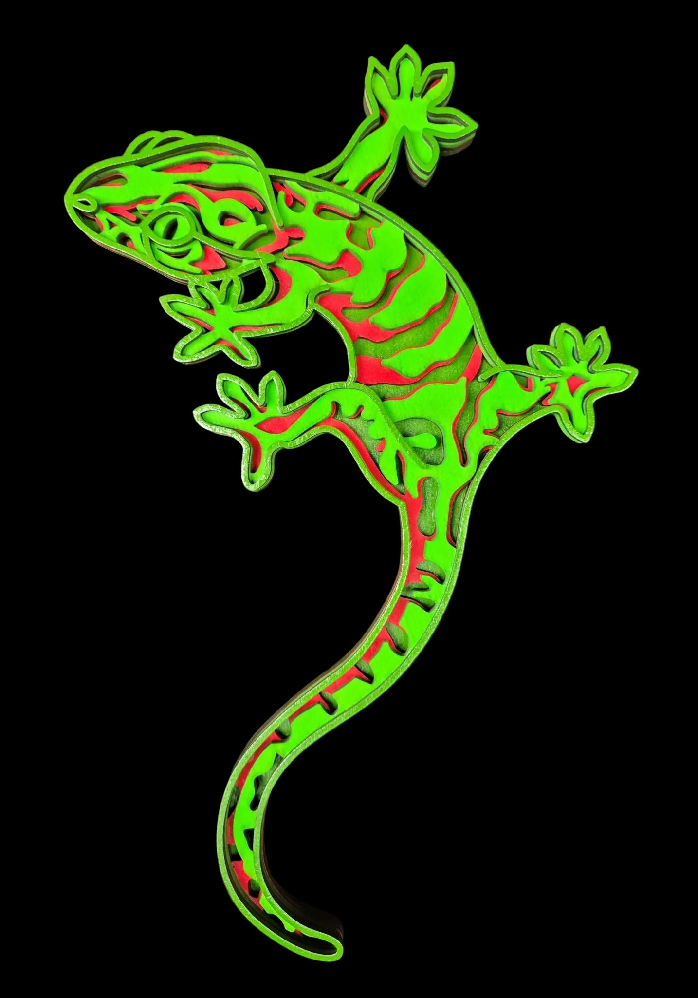 Green and red lizard-shaped object on a gray background