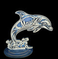 Decorative dolphin sculpture with 'Maui' on a dark background