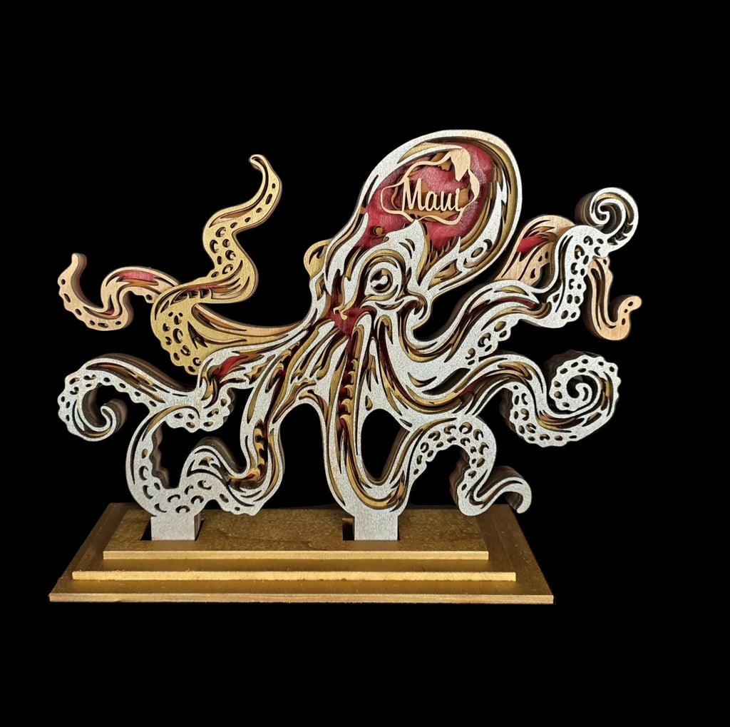Wooden octopus sculpture with 'Mau' engraving on a dark background