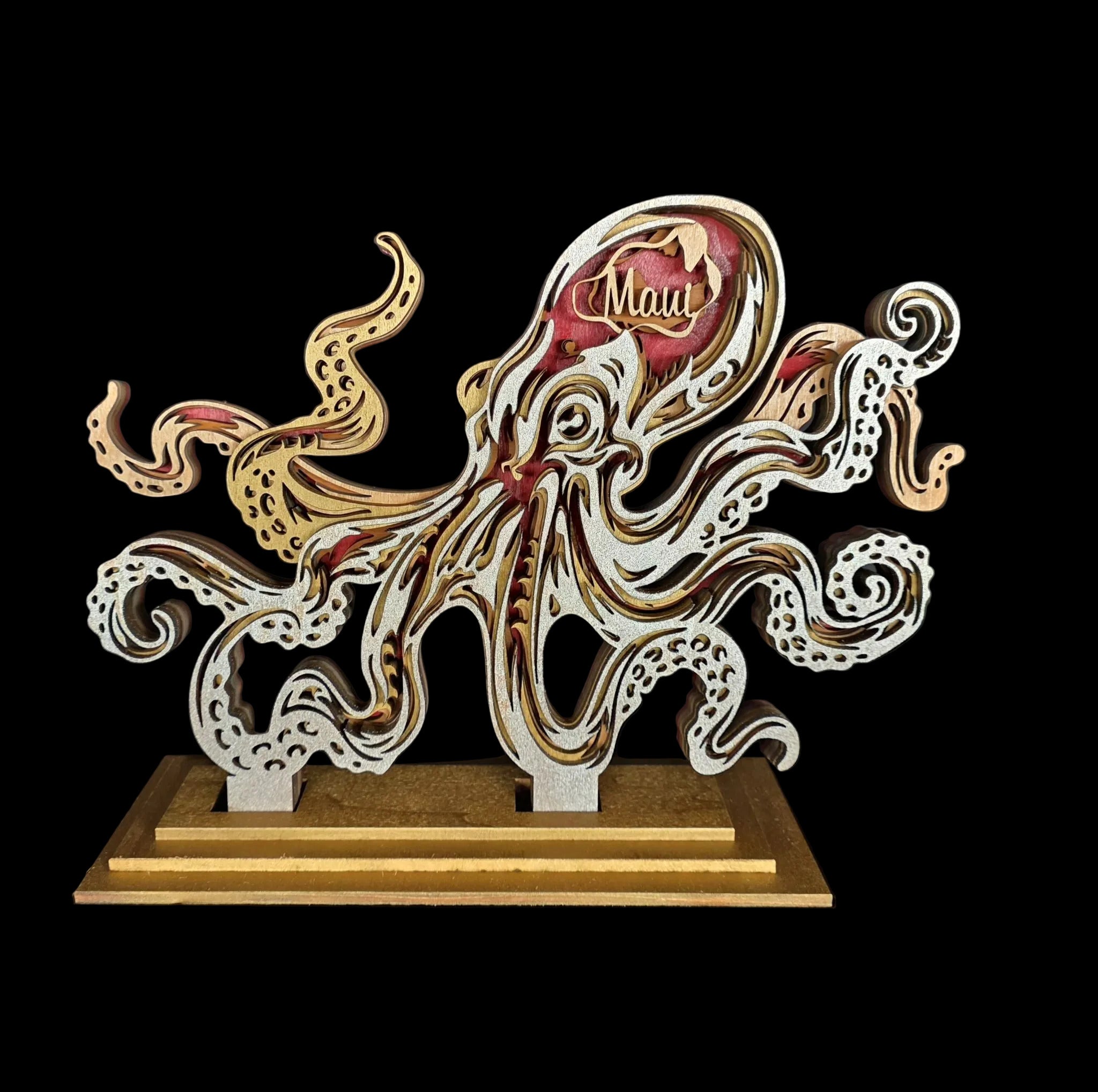 Wooden octopus sculpture with 'Mau' engraving on a dark background