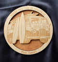 Wooden coaster with a laser-cut design of a van and surfboards, text 'Board Meeting in Progress' and 'Maui, Hawaii'.