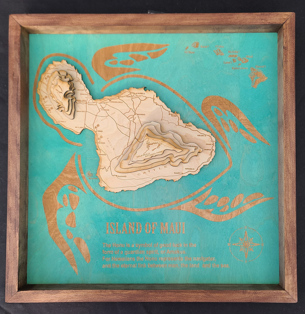 Wooden map of the Island of Maui on a teal background with a wooden frame.