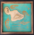 Wooden map of the Island of Maui on a teal background with a wooden frame.