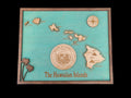Wooden map of The Hawaiian Islands with a teal background and wooden border.